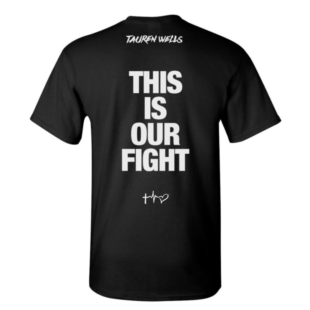 Back of Black Tee with text This Is Our Fight in middle and Tauren Wells logo on top below collar