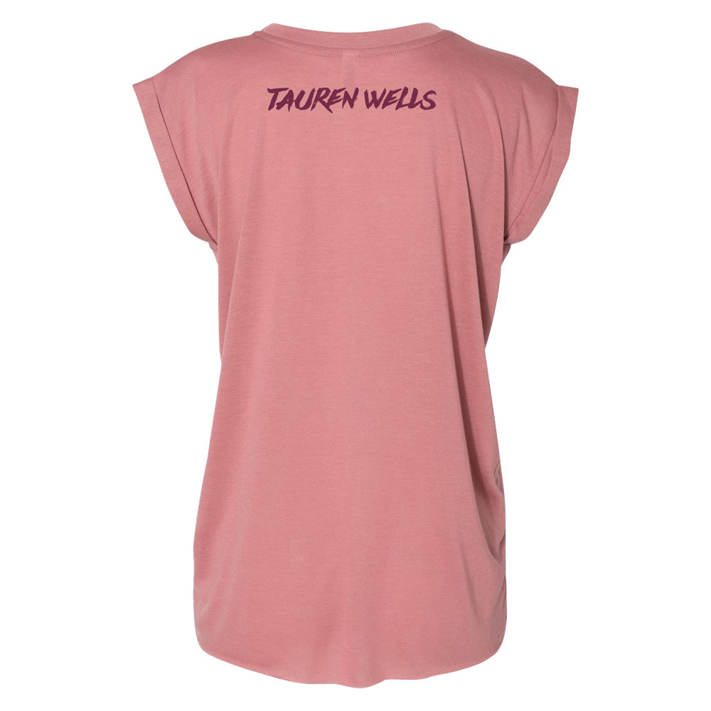 Rose colored women's drapey tee with Tauren Wells logo on upper back