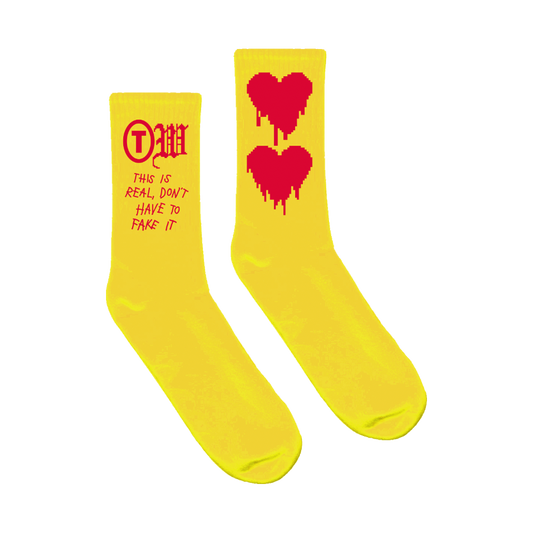 This is real don't have to fake it drip red heart yellow socks product shot Tauren Wells